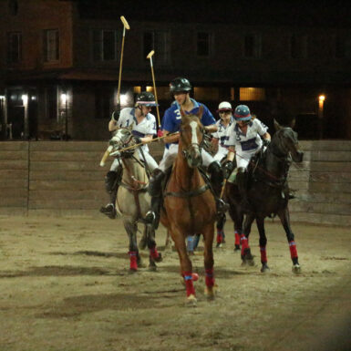 people playing arena polo at night